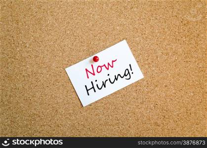 Sticky Note On Cork Board Background Now Hiring concept