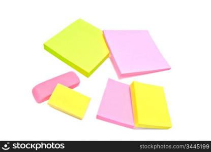 sticky notes and erasers close-up on white