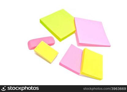 sticky notes and erasers on white