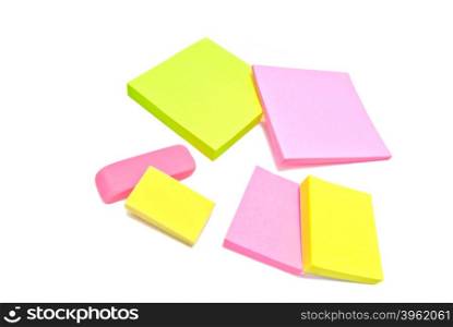 sticky notes and erasers on white background