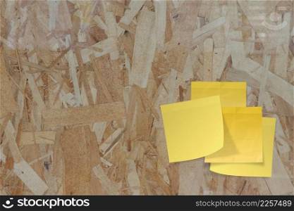 sticky paper note on recycled compressed wood chippings board as concept