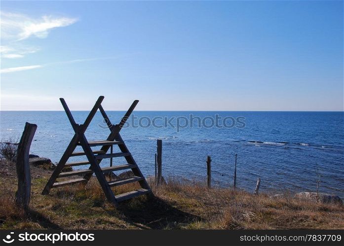 Stile by a fence at the coast. From the swedish island Oland.