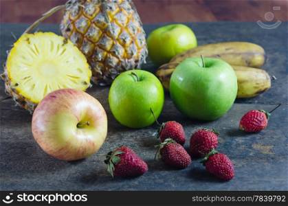 still lfe of mix fruits , apple with strawberry, pineapple and banana