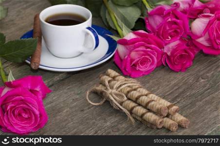 still life bouquet of roses, cup of black coffee, linking of cookies and one rose, subject beautiful flowers and drinks, greeting card