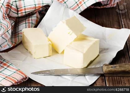 Still life butter on wooden background