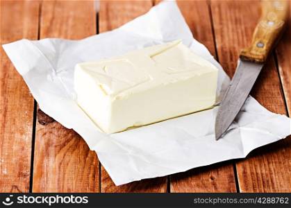 Still life butter on wooden background