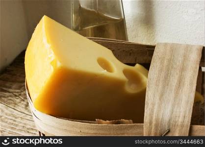 still-life, cheese in a basket