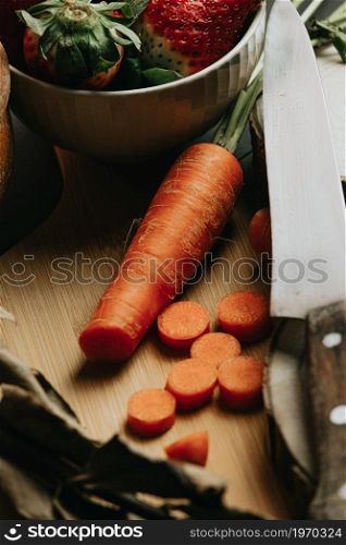 Still life concept shot of spanish cooking with a carrot and different accesories for the kitchen