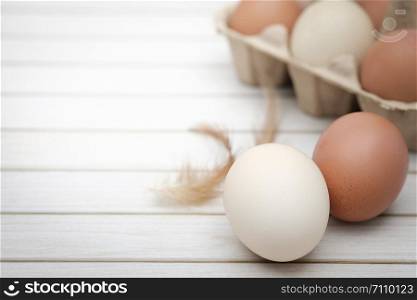 Still life-Eggs on caton box arranged in a white rustick scene, Egg is beneficial to the body, Food concept, with copy space.