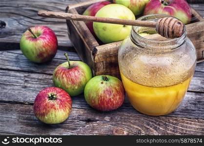 Still life from the harvest of ripe apples and honey
