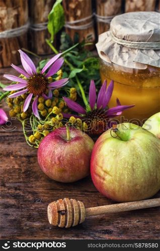 Still life from the harvest of ripe apples and honey to the Church celebration of the apple feast day.Photo tinted.
