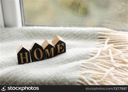 Still life home decor in a cozy house with wooden letters with the inscription home. The concept of decor and comfort. selective focus.. Still life home decor in a cozy house with wooden letters with the inscription home. The concept of decor and comfort. selective focus