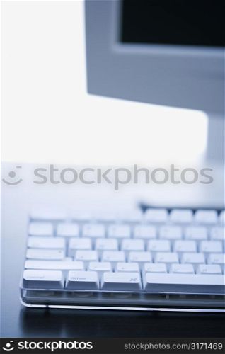 Still life of computer monitor and keyboard.