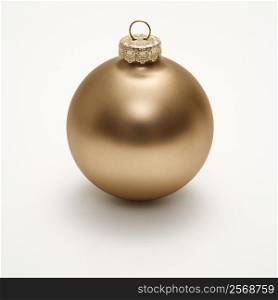 Still life of gold Christmas ornament.