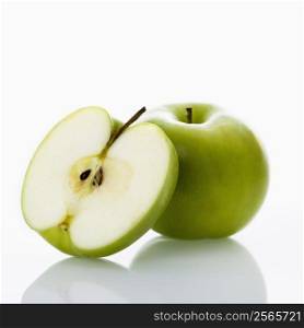 Still life of green apples on white background.