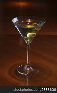 Still life of martini on bar.