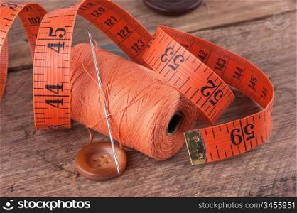 still life of spools of thread on a wooden background