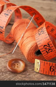 still life of spools of thread on a wooden background