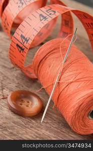 still life of spools of thread on a wooden background