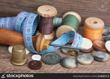 still life of spools of thread on a wooden background