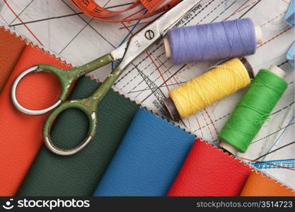 still life of spools of thread on a wooden background