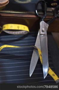 Still Life of Tailor&rsquo;s Scissors with Measuring Tape and Pinstriped Cloth