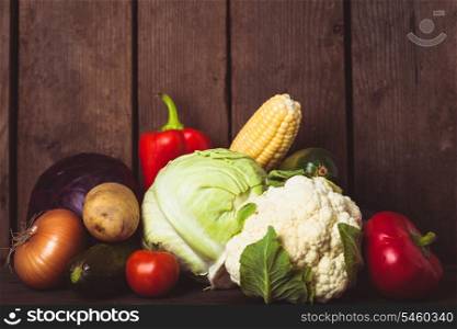 Still life of vegetables on the wood background closeup