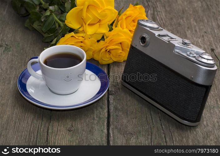 still life on a retro, the camera, roses and coffee