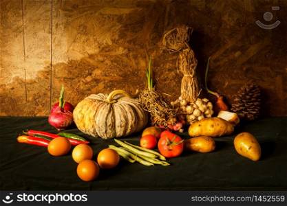 Still life photography with pumpkin, spices, herbs, vegetables and fruits. For cooking