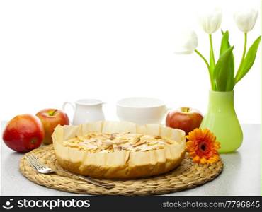 Still life with apple pie, apples and tulips