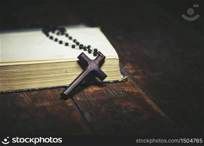 still life with bible and prayer beads