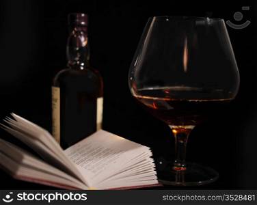 Still Life With Bottle, Glass And Open Book.