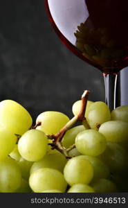 Still-life with bunch of grapes and red wine