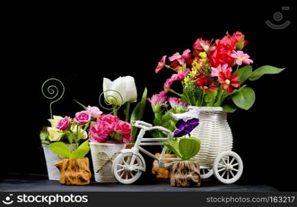 still life with flower and ornamental on black background