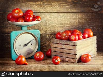 still life with fresh tomatoes on wooden background