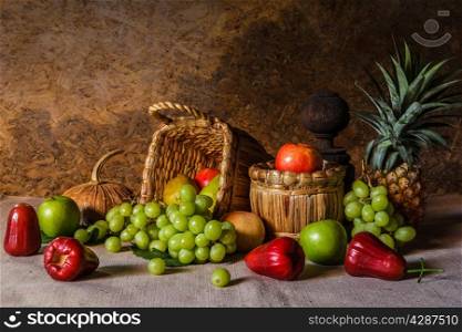 Still life with fruits placed in a basket made ??of natural materials.