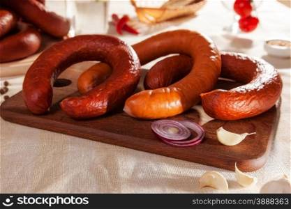 Still life with ham sausage. sausage slices on a cutting board