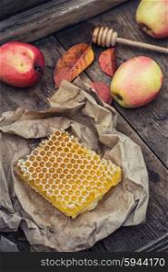 Still life with honeycombs. Still life with honeycombs apples and autumn leaves