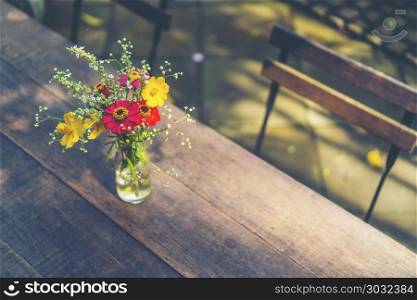 Still life with huge bunch of autumn flowers and roses and fruits