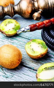 Still life with kiwi hookah. East hookah with the aroma kiwi for relax.Kiwi shisha