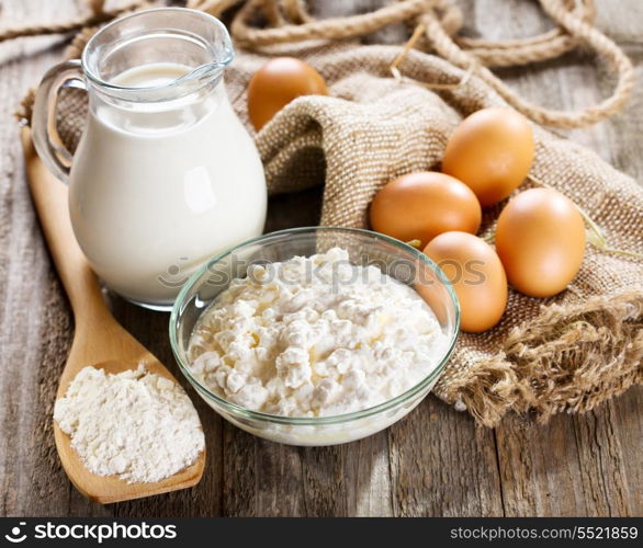 still life with milk, cottage cheese, eggs and flour