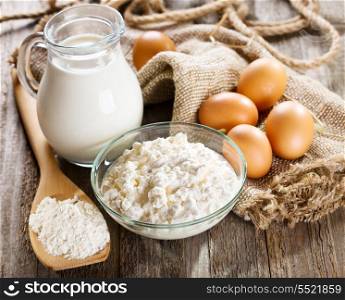 still life with milk, cottage cheese, eggs and flour