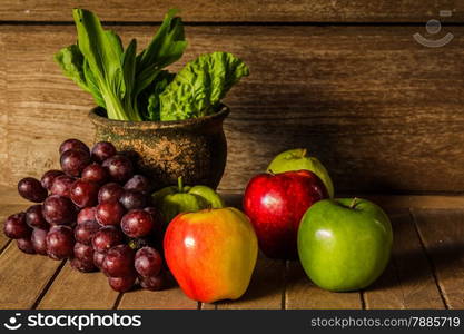 Still life with on the timber full of fruit in the kitchen.