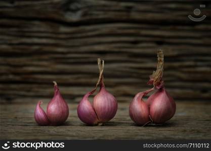 Still life with onion on rustic wooden table, Choose a focal point.