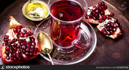 still life with pomegranate tea.. turkish winter tasty tea with pomegranate seeds