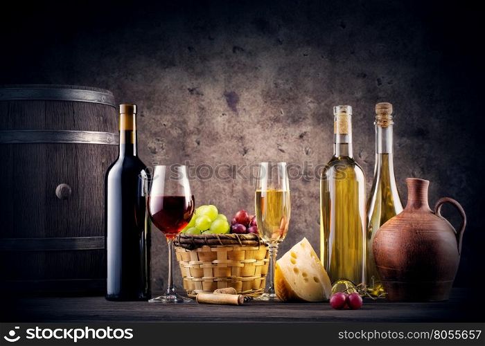 Still life with red and white wine on dark background. Still life with red and white wine