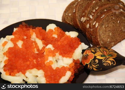 Still life with Russian national food caviar and potatoes