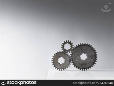 Still life with three old cog gears. Lots of copy space.