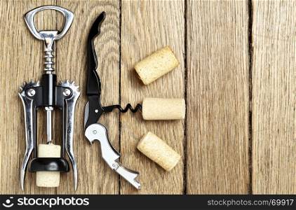 Still life with two cork-screws and wine corks with space for text