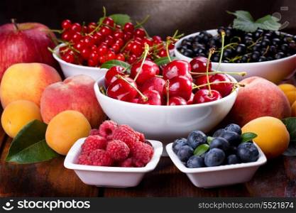 still life with various fresh fruits and berries